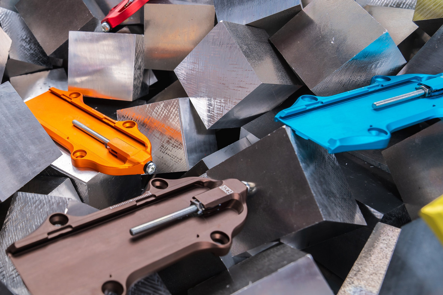 Cpver image with many PowerPlates on the aluminum cube they are machined from as a cover for our Tariffs blog article